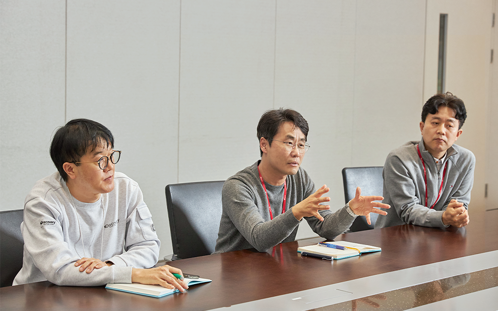 Figure 3. (From left to right) Hwanuk Song, Buseup Song, and Youngjun Jeong of the Material Recycling department discuss recycling innovations