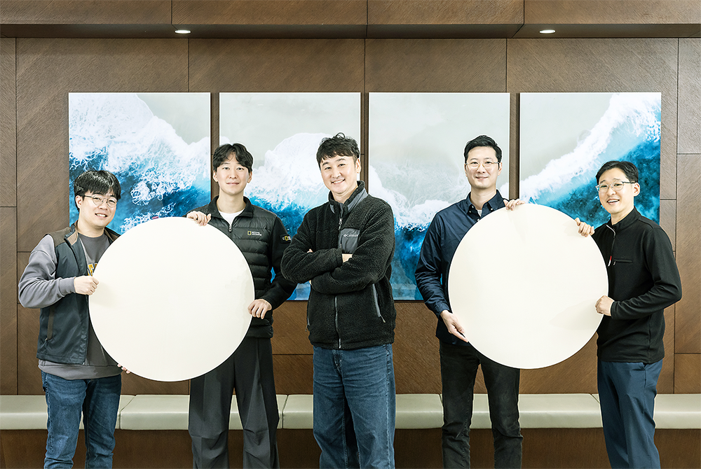 The CMP pad development team proudly holding samples of the recycled pads (from left to right: Joowon Kang, Juncheol Lee, Jaewon Jo, Kyungwon Kim, and Heejun Kim)